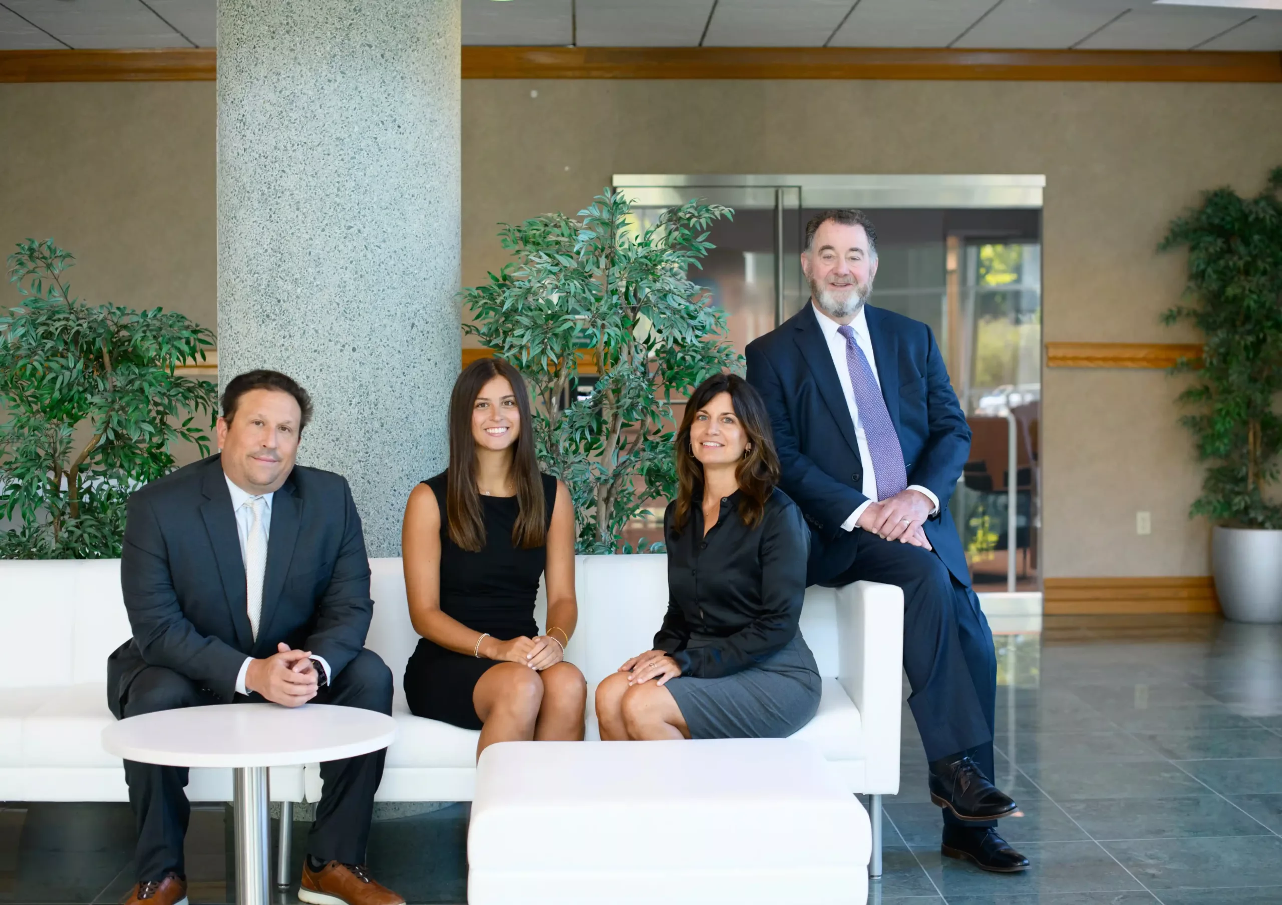 Eleiva Financial team of four seated in an office lobby